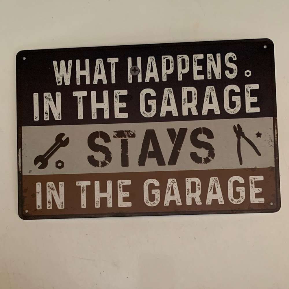 Garage Sign with Black, Gray, and Brown Text